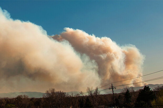 smoke rising from a landscape